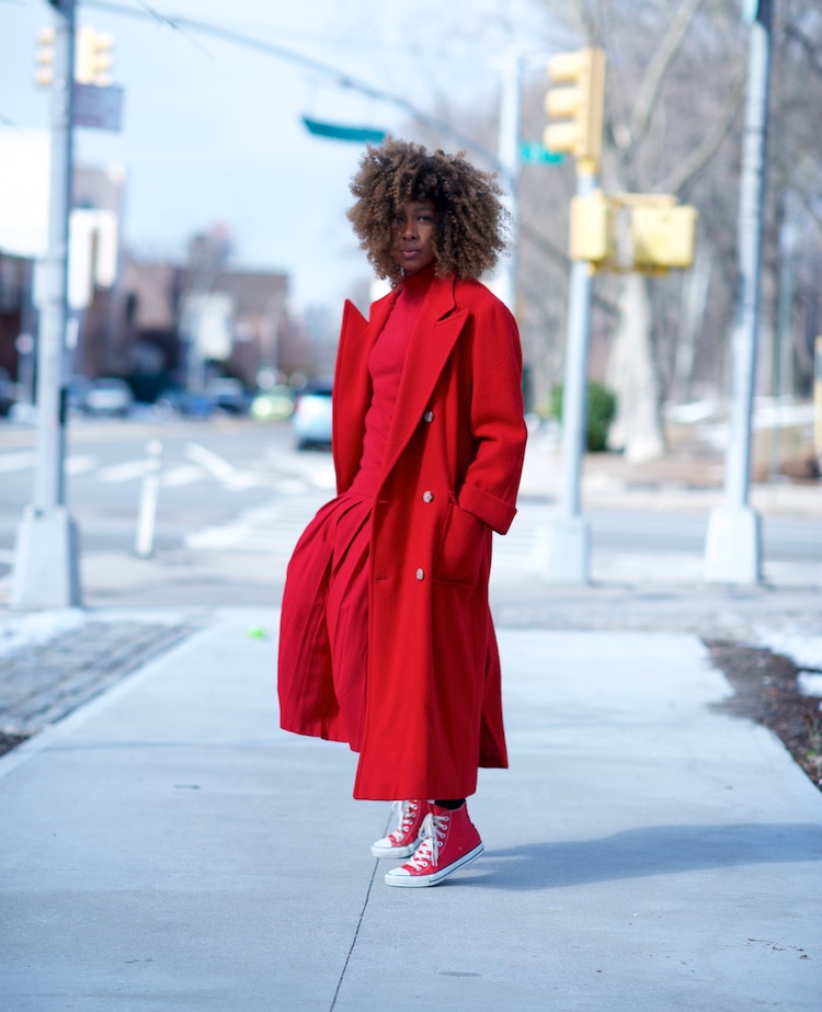 karen blanchard the fashion blogger wearing a red Ralph Lauren wool coat with a red pleated skirt and red converse sneakers
