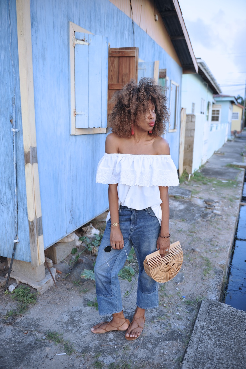 Karen Blanchard wearing an off the shoulder top with H&M wide leg jeans the Cult Gaia Ark bag