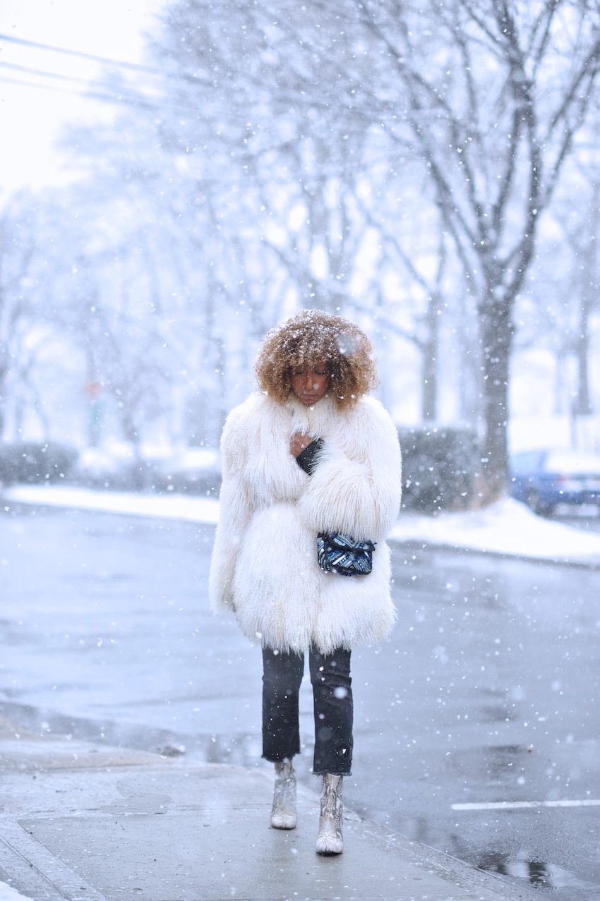 Karen Blanchard the fashion blogger wearing a mongolian fur coat and free people snake print boots