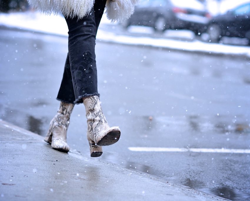 Karen Blanchard wearing snake print ankle boots