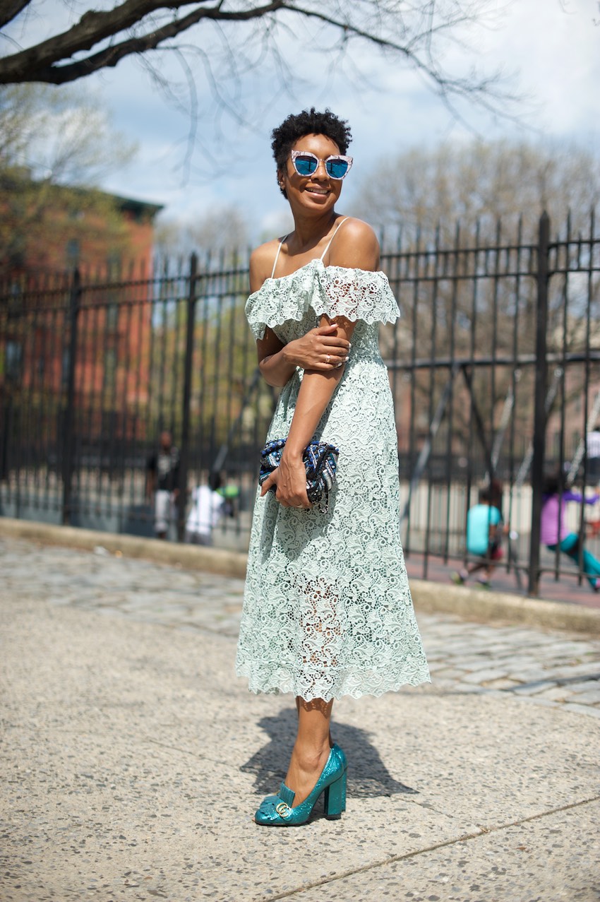 Karen Blanchard the black fashion blogger wearing an H&M off the shoulder lace dress with Gucci marmont heels and statement sunglasses