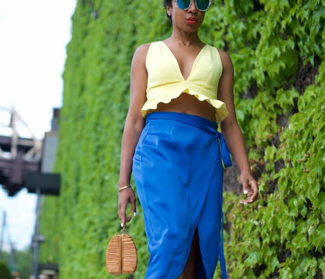 karen blanchard the fashion blogger wearing a yellow bralet top and satin skirt
