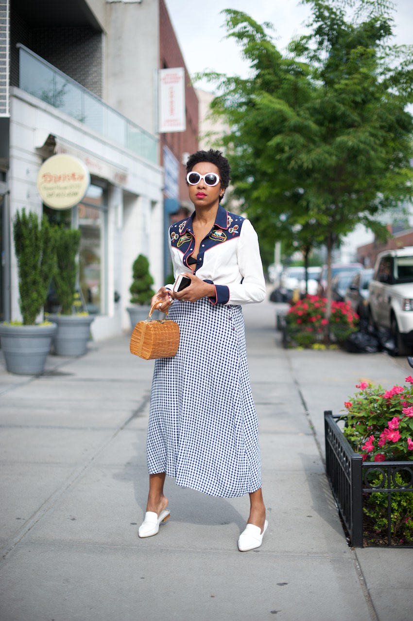 Karen Blanchard the fashion blogger and youtuber is wearing a vintage gingham skirt with a basket bag