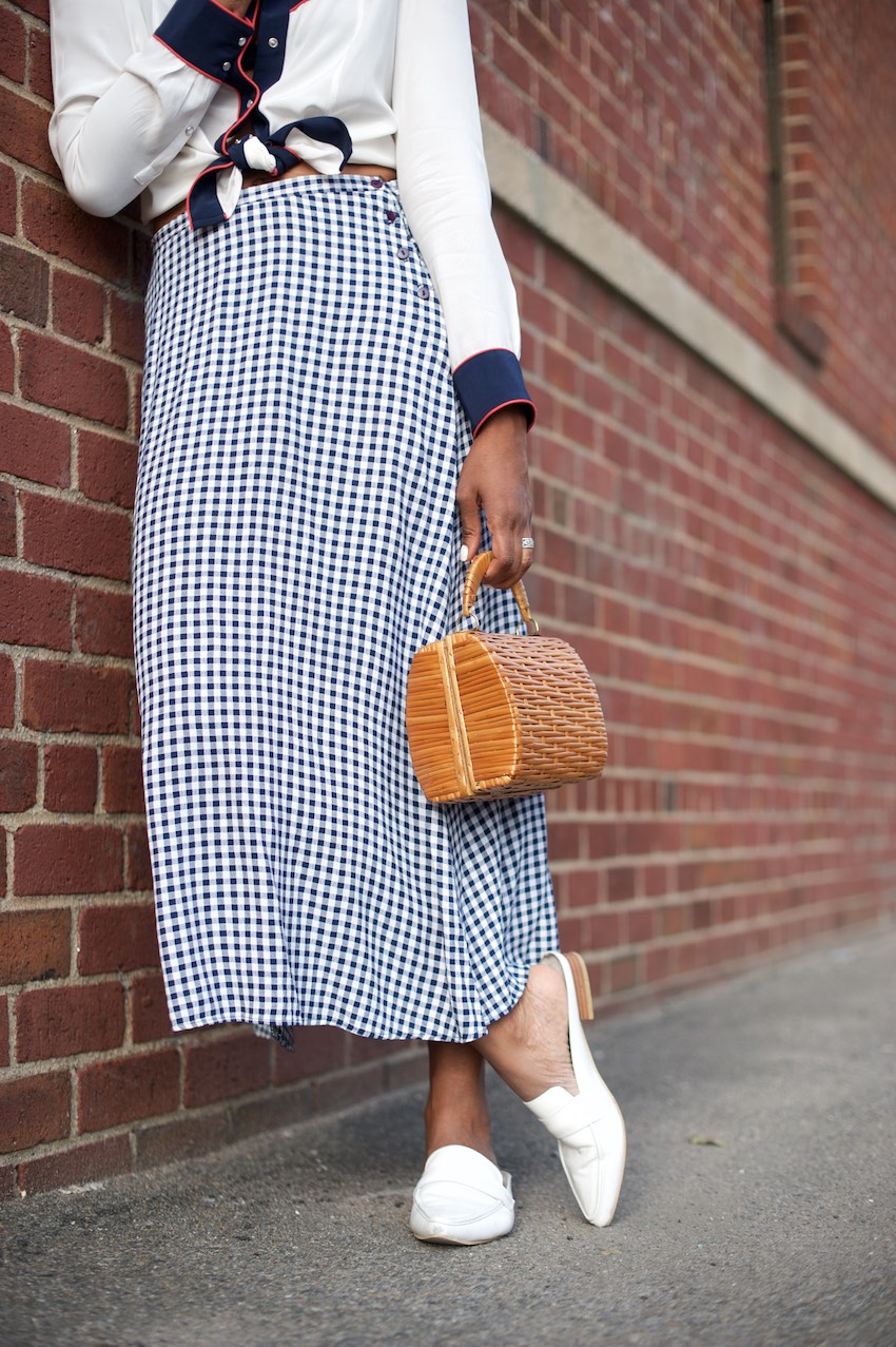 Karen Blanchard is carrying a vintage basket bag and a vintage gingham skirt