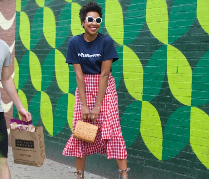 Karen Blanchard is wearing white sunglasses with a gingham ruffle skirt and Castaner espadrilles